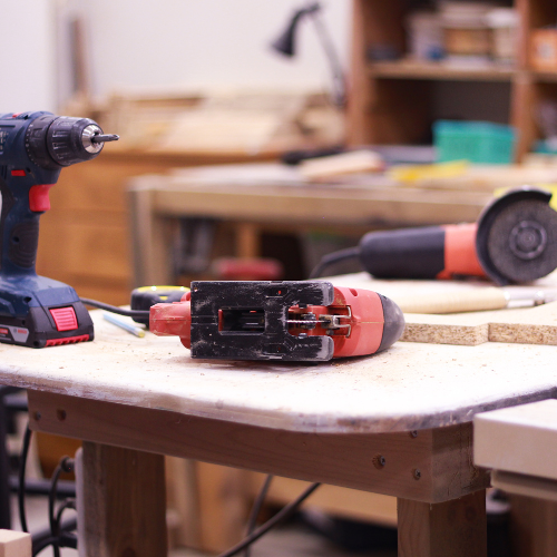 Various power tools spread across a table.